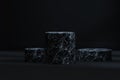 The marble cylinder platform in the dark room, 3d rendering