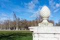 Marble egg on podium against of sunny lawn Royalty Free Stock Photo