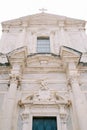 Marble facade with sculptures above the entrance of the Church of St. Ignatius. Dubrovnik, Croatia