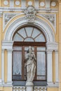 Marble figure of woman playing the pipes in facade of Ciniselli Circus in Saint Petersburg