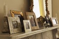 Marble Fireplace Mantel With Framed Pictures And Mirror Royalty Free Stock Photo