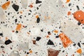Marble floor with orange & black speckles
