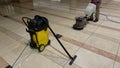 Marble floor polishing with a professional floor scrubber and wet vacuum cleaner in office building lobby Royalty Free Stock Photo