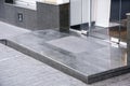 Marble gray porch step with a foot mat at the entrance. Royalty Free Stock Photo