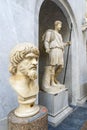 A marble Head of a Dacian with a statue of a standing man with a spear in the back in one of the museums in Vatican City, Rome