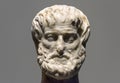 Marble head of Greek philosopher Aristotle isolated on gray Royalty Free Stock Photo