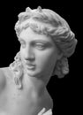 Marble head sculpture of young woman, ancient Greek goddess art bust statue isolated on black background Royalty Free Stock Photo