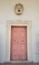 Marble head scuplture in the top of an old door