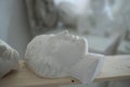 Marble heads of greek people in workshop of sculptor