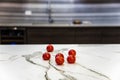 Marble kitchen countertop with tomatoes on. Counter concept.