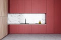 Marble kitchen interior with red countertops Royalty Free Stock Photo