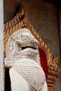 Marble lion guarding entrance (Wat Benchamabophit Dusitvanaram) Royalty Free Stock Photo