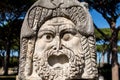 Marble Mask decoration in Ostia Antica theatre. Ancient Rome 1st century mask in the proscenium of Ostia antica, part