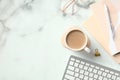 Marble office desk table with office supplies, coffee cup, eye glasses, keyboard. Top view with copy space, flat lay Royalty Free Stock Photo