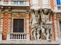 Marble ornamental statues on the facade of a historic building in the center of Genoa Genova, italy.