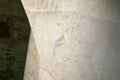 Marble patch close up. Detail in a medieval marble statue. Repair method.