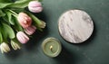 a marble plate with a candle and flowers on a table