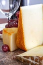 Marble plate with sheep milk cheeses Pur Brebis and Ossau-Iraty from Pyrenees and yellow Saint Paulin cow milk cheese, France Royalty Free Stock Photo