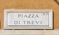 Marble plate with Street name piazza di Trevi- engl: town square of Trevi - at the wall in Rome