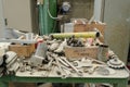 Marble processing workshop. Power tools and tables covered with dust. Henraux factory, Italy