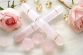 marble and rose quartz facial rollers seen from above