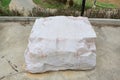 Marble seat in park. Natural stone chair in the garden Royalty Free Stock Photo