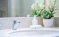 marble sink, toothbrush, soap, tap on light bathroom background