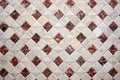 marble slab with an intricate diamond-tiled pattern