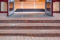 Marble staircase with granite steps to entrance door on store. Royalty Free Stock Photo