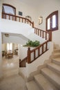 Marble staircase in luxury villa home with wooden bannister Royalty Free Stock Photo