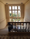 Marble staircase with wrought iron railing in historic building Royalty Free Stock Photo