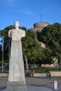 Marble statue of Admiral Nikolaos Votsis in front of the famous White Tower in Thessaloniki, Greece, blue sky, copy space Royalty Free Stock Photo