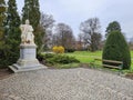 Marble statue of the austrian poet and writer Robert Hamerling sitting in a chair in the city park Stadtpark, in Graz, Steiermark