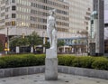 Marble statue of a classic female figure by Marton Varo in front of the Plaza of the Americas