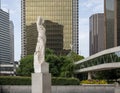 Marble statue of a classic female figure by Marton Varo in front of the Plaza of the Americas