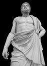 Marble statue of greek god Zeus isolated on black background. Antique sculpture of man with beard