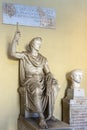 A marble statue of a seated Tiberius Caesar, son of emperor Augustus, in one of the museums in Vatican City, Rome Royalty Free Stock Photo