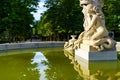 Marble statue in water fountain in the Retiro public park in Madrid,