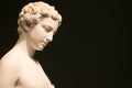 Marble statue of a woman with short hair with bare shoulders