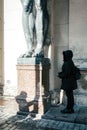 Girl tourist at marble statues of Atlant`s hold ceiling of New Hermitage, St. Petersburg, Russia