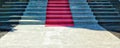 Marble steps, red carpet on the steps with sunlight reflection on floor, sunny shadows on no man steps, gray, black, marble