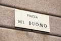 Marble street signage on italian of worldwide famous square Piazza del Duomo. Milan, Italy