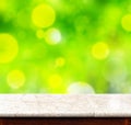 Marble table with green bokeh backgournd,empty interior for add