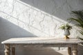 Marble table with white stucco wall background Royalty Free Stock Photo