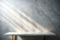 Marble Table with White Stucco Wall Texture Background with Light Beam and Shadow, Suitable for Product Presentation Backdrop, Royalty Free Stock Photo