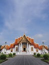 Marble temple under cloudy sky