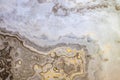 Marble texture with beautiful abstract interlayers. Cold and warm colors. Yellow, white and blue stone, background Royalty Free Stock Photo