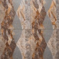 Marble texture featuring a mix of earthy tones, including gray, beige, and brown, with prominent veining and speckled patterns Royalty Free Stock Photo