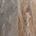 Marble texture featuring a mix of earthy tones, including gray, beige, and brown, with prominent veining and speckled patterns Royalty Free Stock Photo