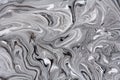 Marble texture formed by mixing white gray  paints, abstract background Royalty Free Stock Photo